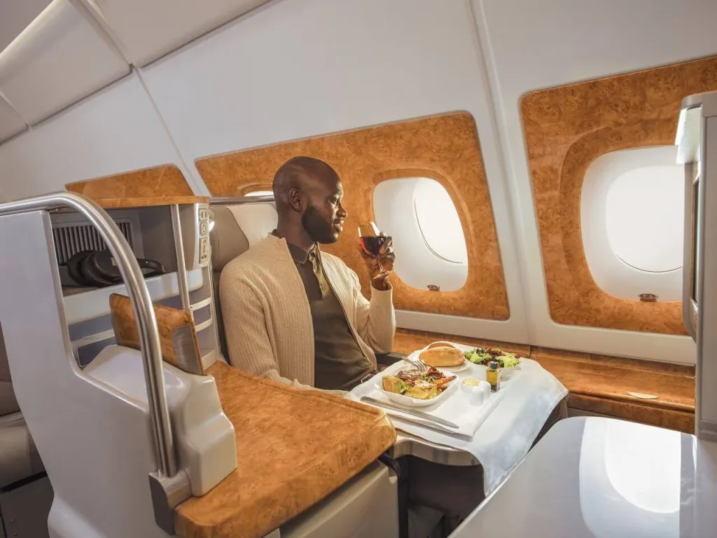 Emirates Business Class Seats - Black Man Sitting in Business Class - Enjoying, and Eating