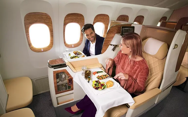 Emirates Business Class Seats - Woman and Man Sitting in Business Class - Enjoying and Relaxing