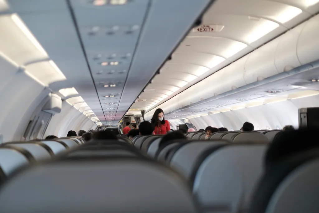 People Seating on Airplane Seat - | Oceans Travel Blog