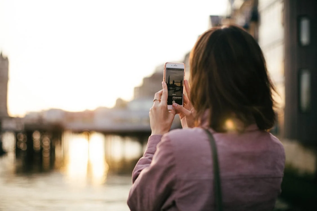 Lady Taking Picture of Monument | Oceans Travel 