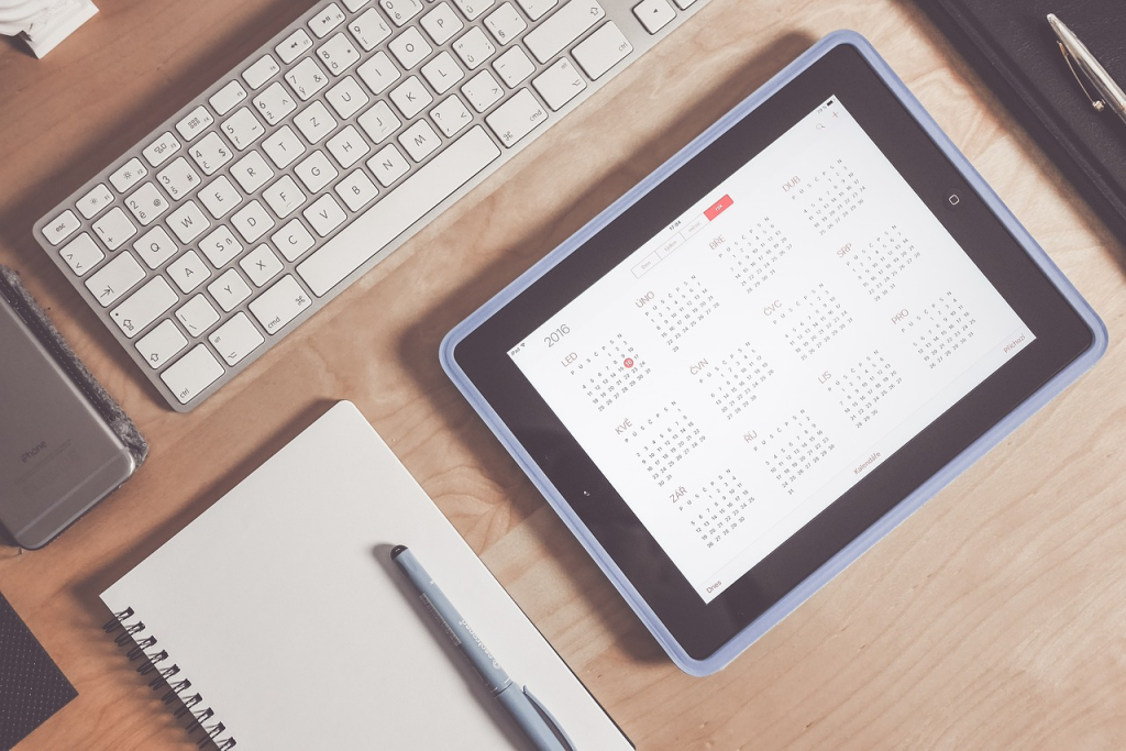 School Holiday Term Dates for 2024 to 2025 Academic Year | Photo of Calendar on Tablet at Desk with Equipment neatly around it